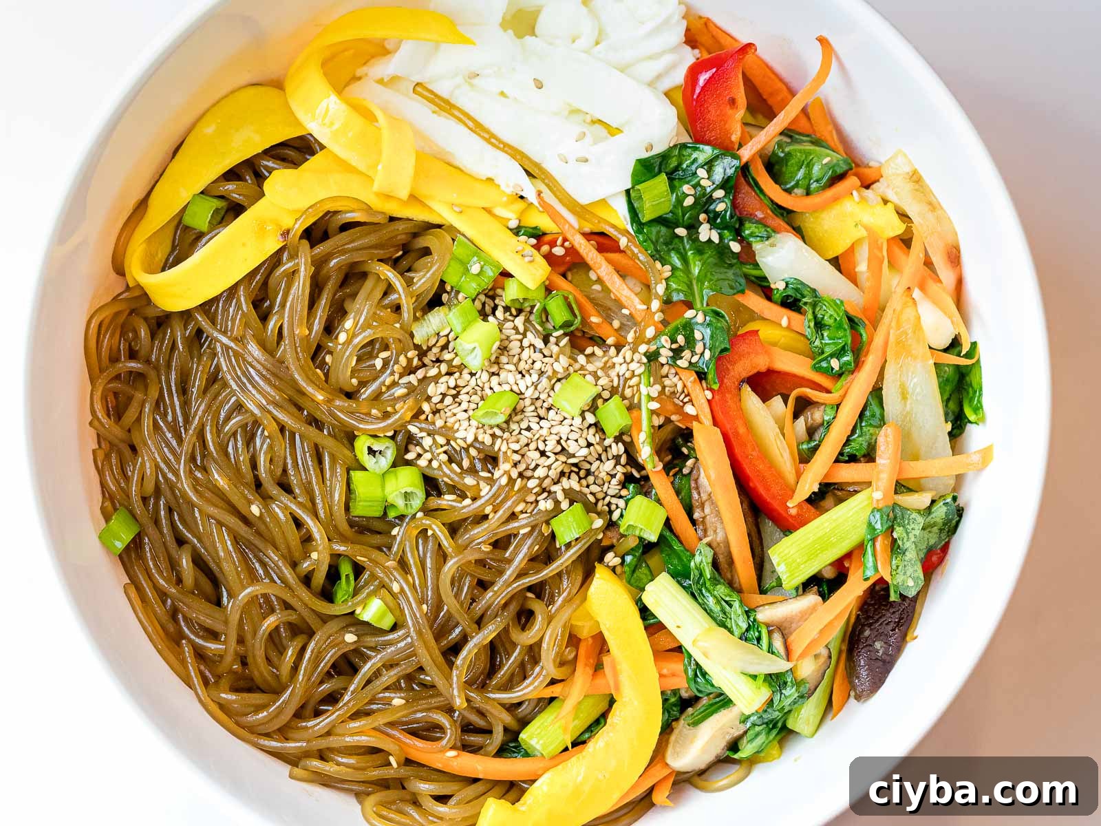 Authentic Japchae: Korean Glass Noodle Stir Fry Recipe 12 Korean glass noodles with stir fried colorful vegetables and sesame seeds