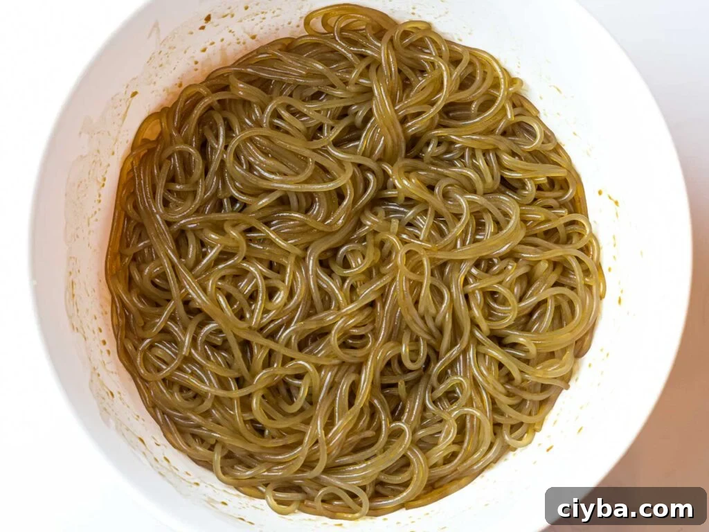 Authentic Japchae: Korean Glass Noodle Stir Fry Recipe 7 cooked japchae noodles with japchae sauce