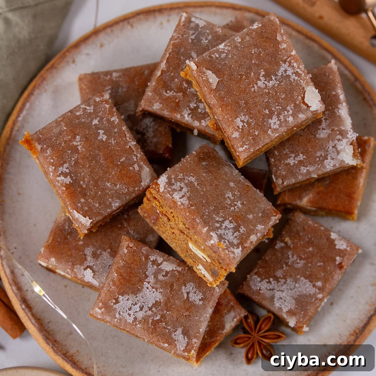 square crop of a plate full of gingerbread bars.