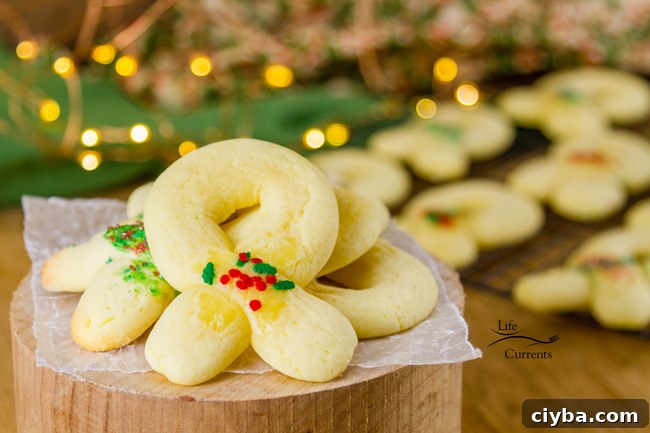 Berliner Kranz Cookies - traditionally made into wreath shapes and decorated with some little bit of red and green sugars