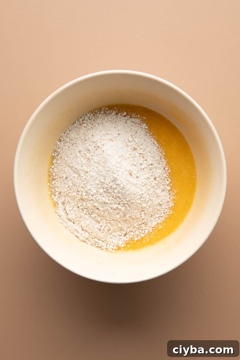 Matzo Balls Recipe: Classic, Light & Fluffy 7 matzo balls step 2: adding matzo meal to whisked eggs and oil