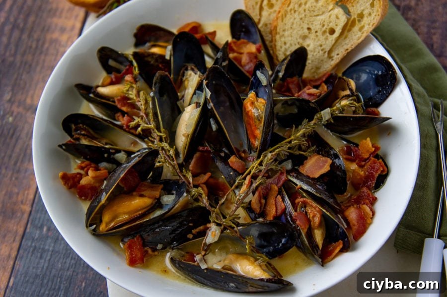 a bowl of mussels in cider cream sauce
