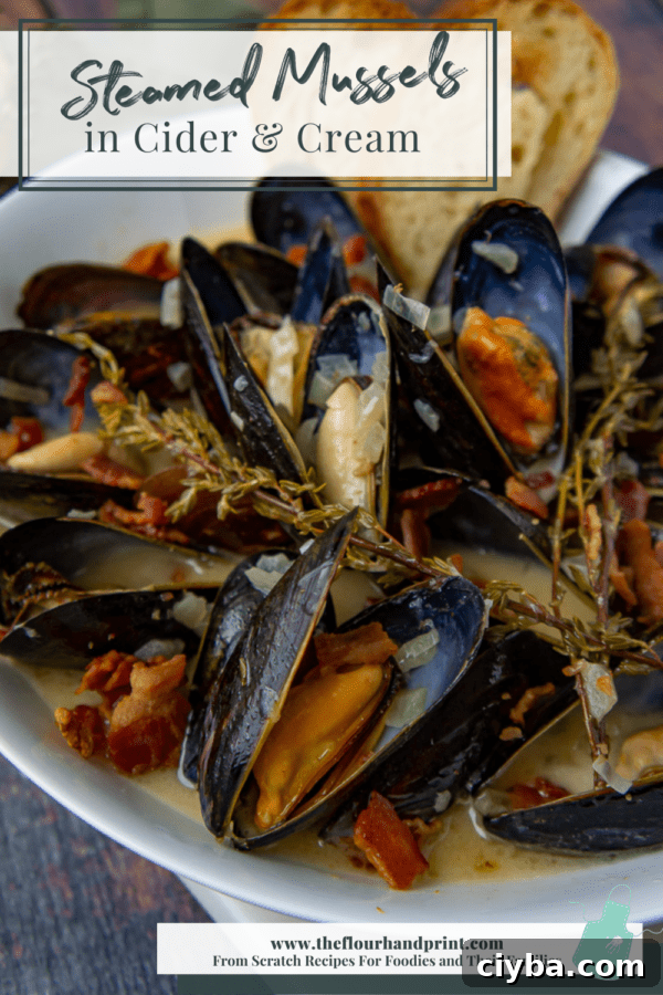 white bowl with mussels, bacon, and thyme in cider cream