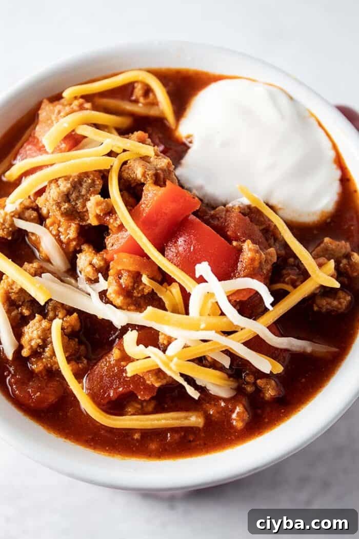 Keto Super Bowl Party Menu: Low-Carb Game Day Recipes 28 overhead view of low carb turkey chili with sour cream and cheese on top