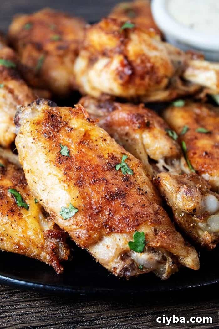 Keto Super Bowl Party Menu: Low-Carb Game Day Recipes 33 sideview of black plate with air fryer chicken wings crispy and ready to serve