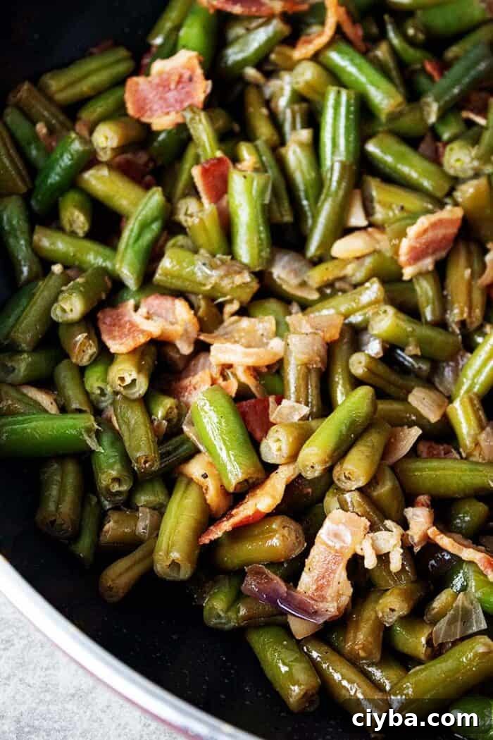 Keto Super Bowl Party Menu: Low-Carb Game Day Recipes 37 overhead view of ready to serve bacon and onion green beans recipe in a skillet on stovetop
