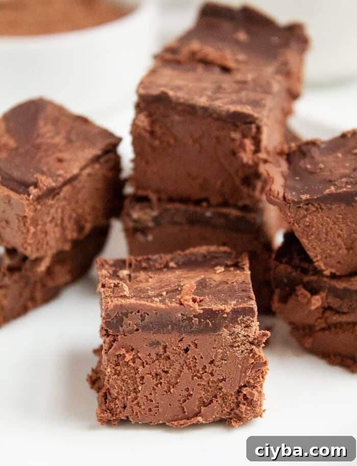 Keto Super Bowl Party Menu: Low-Carb Game Day Recipes 45 keto chocolate dessert on a white plate in front of almond milk and cocoa powder in a white bowl