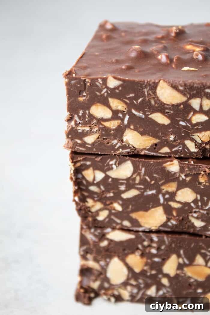 Keto Super Bowl Party Menu: Low-Carb Game Day Recipes 46 sideview of stack of three homemade cruch bars that are low carb, sugar free, gluten free, keto and healthy on a white background