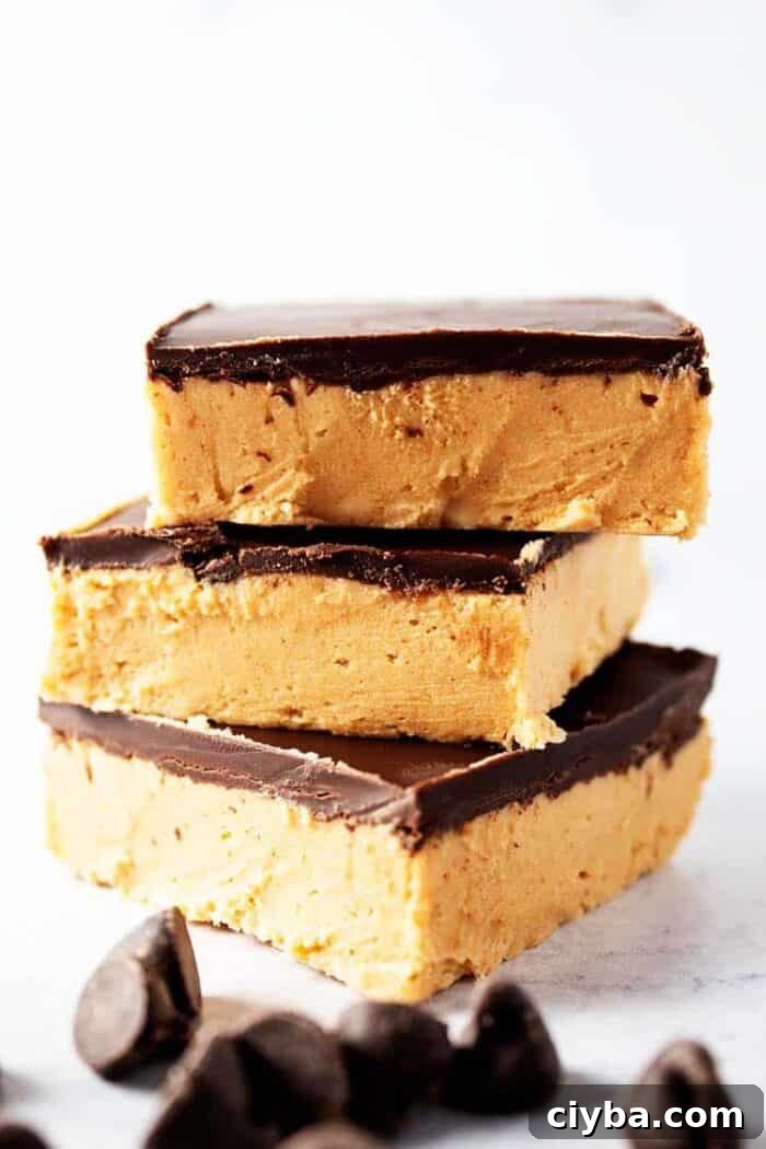 Keto Super Bowl Party Menu: Low-Carb Game Day Recipes 47 side view of three pieces of keto no bake peanut butter bars with chocolate chips scattered in front