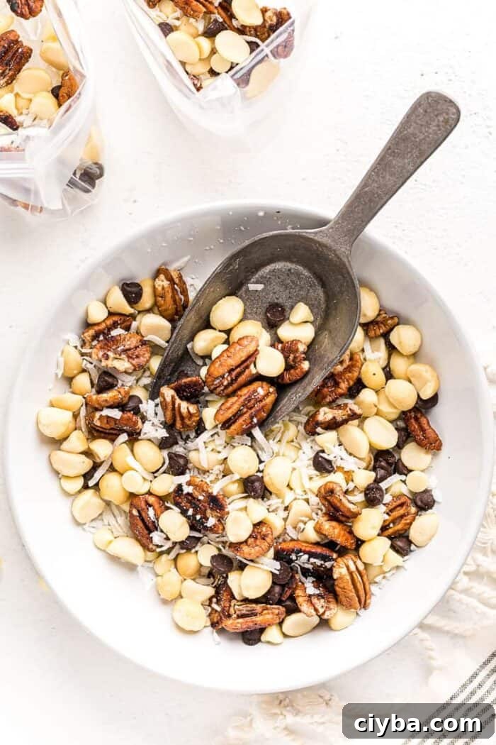 Keto Super Bowl Party Menu: Low-Carb Game Day Recipes 8 overhead view of keto trail mix in a white bowl with a spoon
