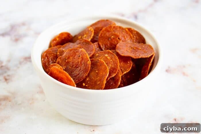 Keto Super Bowl Party Menu: Low-Carb Game Day Recipes 9 keto pepperoni chips in a white bowl on a countertop