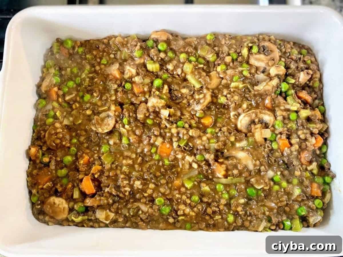 Hearty Vegan Shepherd's Pie with Lentils and Mushrooms 8 Layer the vegan shepherd's pie filling into a 9 X 13-inch pan. This is the first layer of cottage pie in a pan.