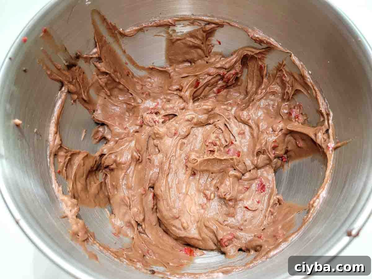 chocolate cherry cheesecake batter in a mixing bowl.