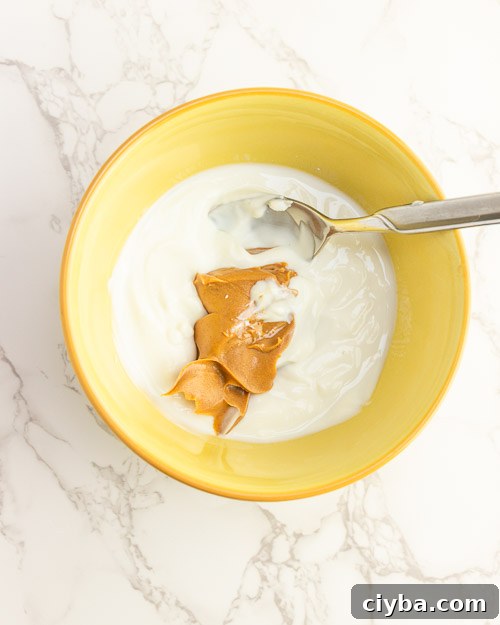 Mixing the peanut butter yogurt.