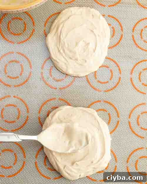 Dropping the yogurt mix onto the tray.