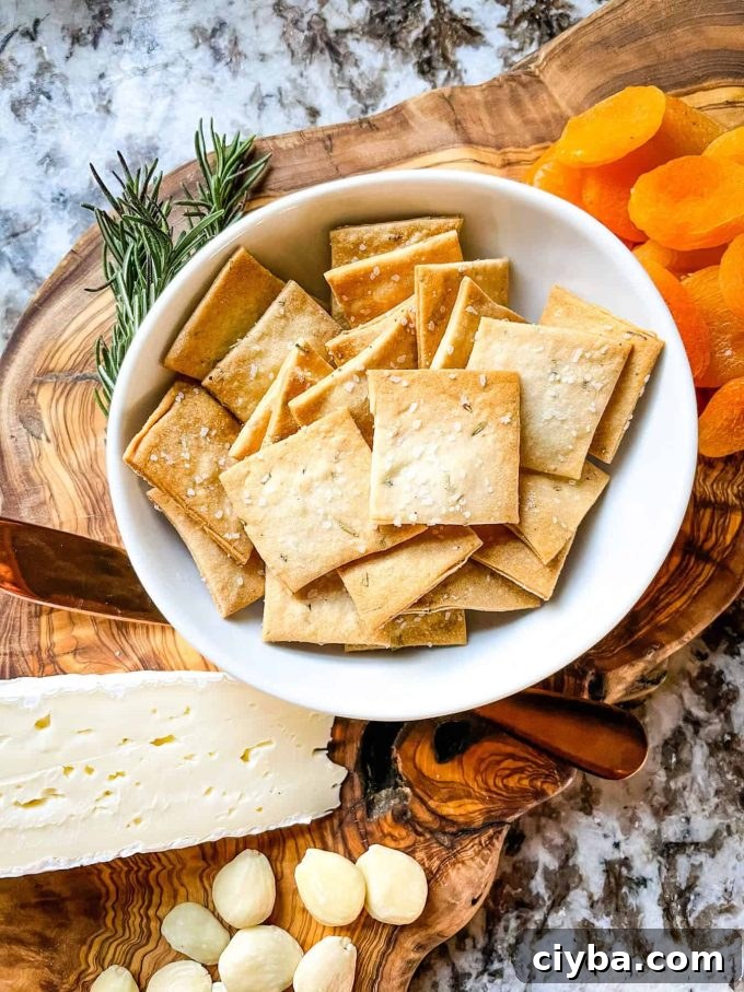 An aerial photo of rosemary sourdough crackers in a bowl.