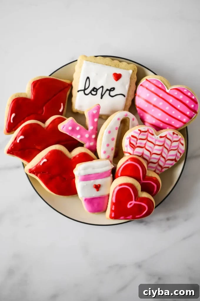 An aerial photo of a plate of sourdough sugar cookies decorated for Valentine's Day.