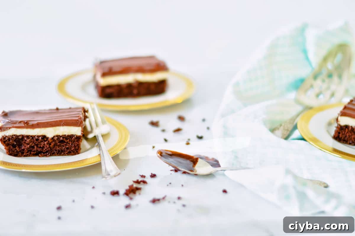 Ho Ho Cake: Chocolate Roll with Cream Filling 2 slices of hostess ho ho cake on gold rimmed plates.