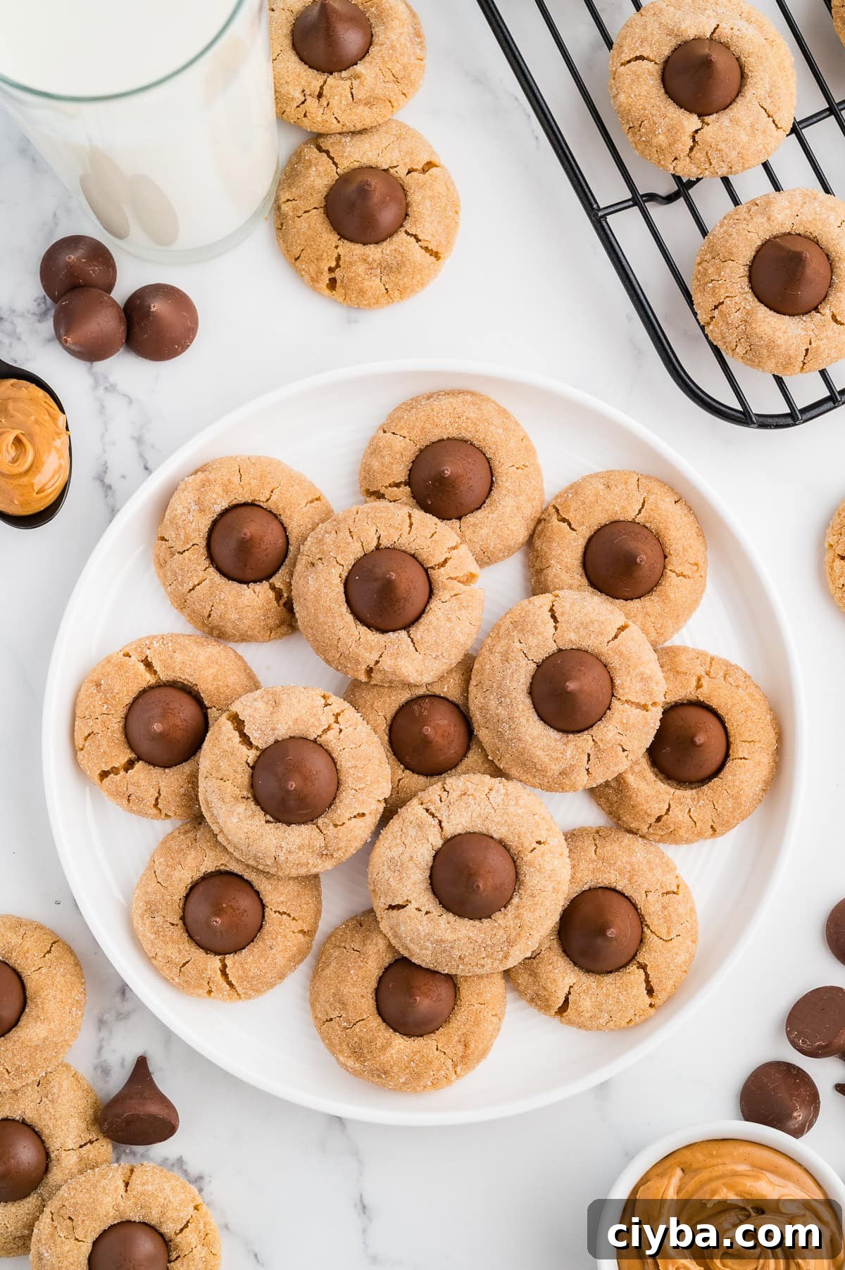 Gluten-Free Peanut Butter Blossoms with Dairy-Free Option 3 Easy Gluten Free Peanut Butter Blossoms (Dairy Free Option Too!) on a plate with chocolate kisses around