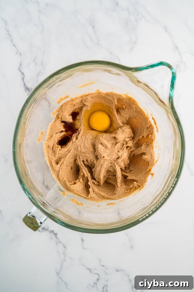 Gluten-Free Peanut Butter Blossoms with Dairy-Free Option 6 Easy Gluten Free Peanut Butter Blossoms (Dairy Free Option Too!) wet ingredients in a glass bowl