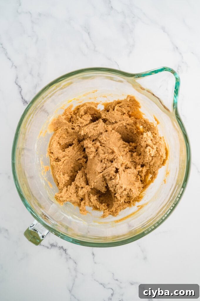 Gluten-Free Peanut Butter Blossoms with Dairy-Free Option 8 Easy Gluten Free Peanut Butter Blossoms (Dairy Free Option Too!) dough in a glass bowl