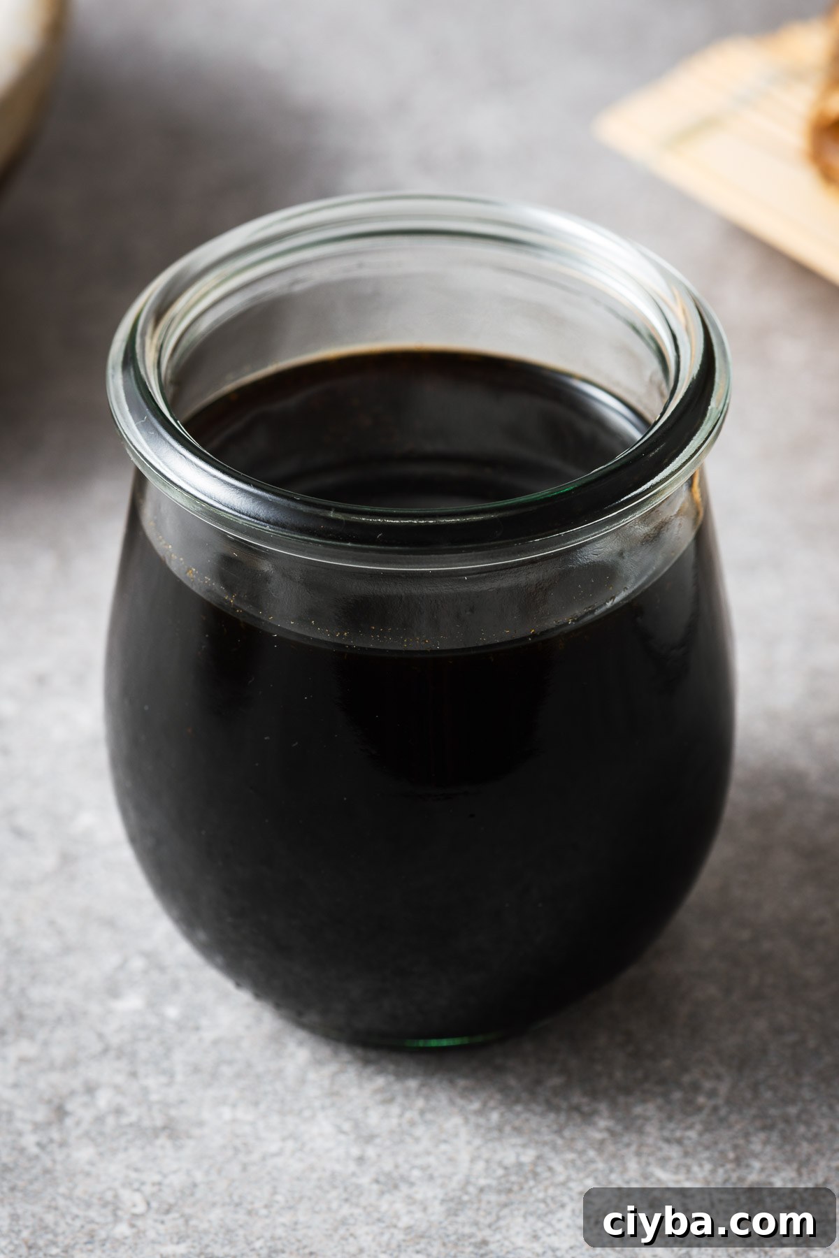 A glass jar with mentsuyu (Japanese soup broth concentrate).