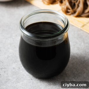 A glass jar with homemade mentsuyu, the concentrated Japanese soup base.