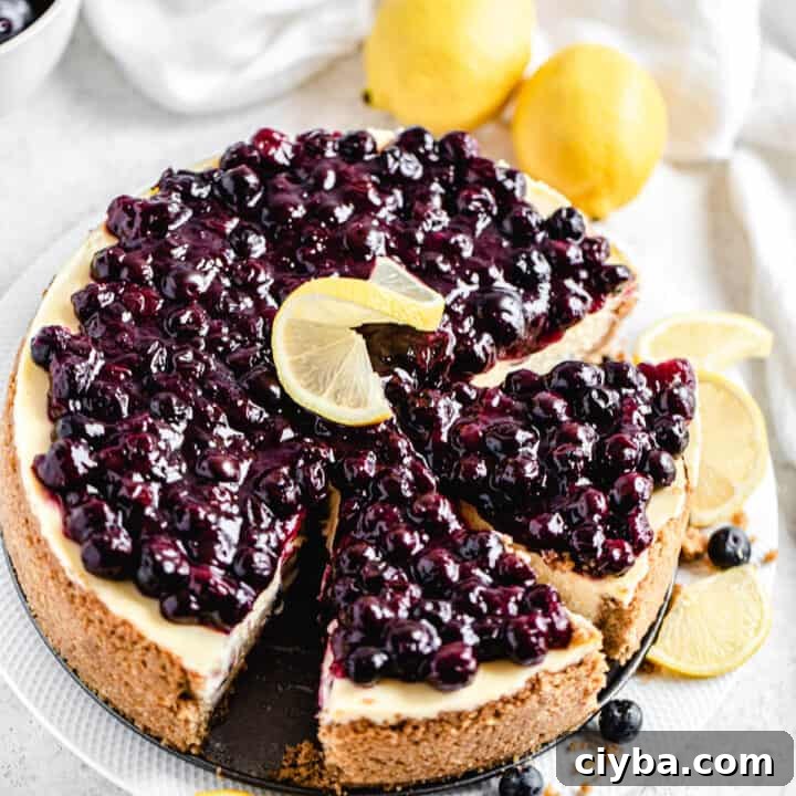 half sliced cheesecake on a white platter