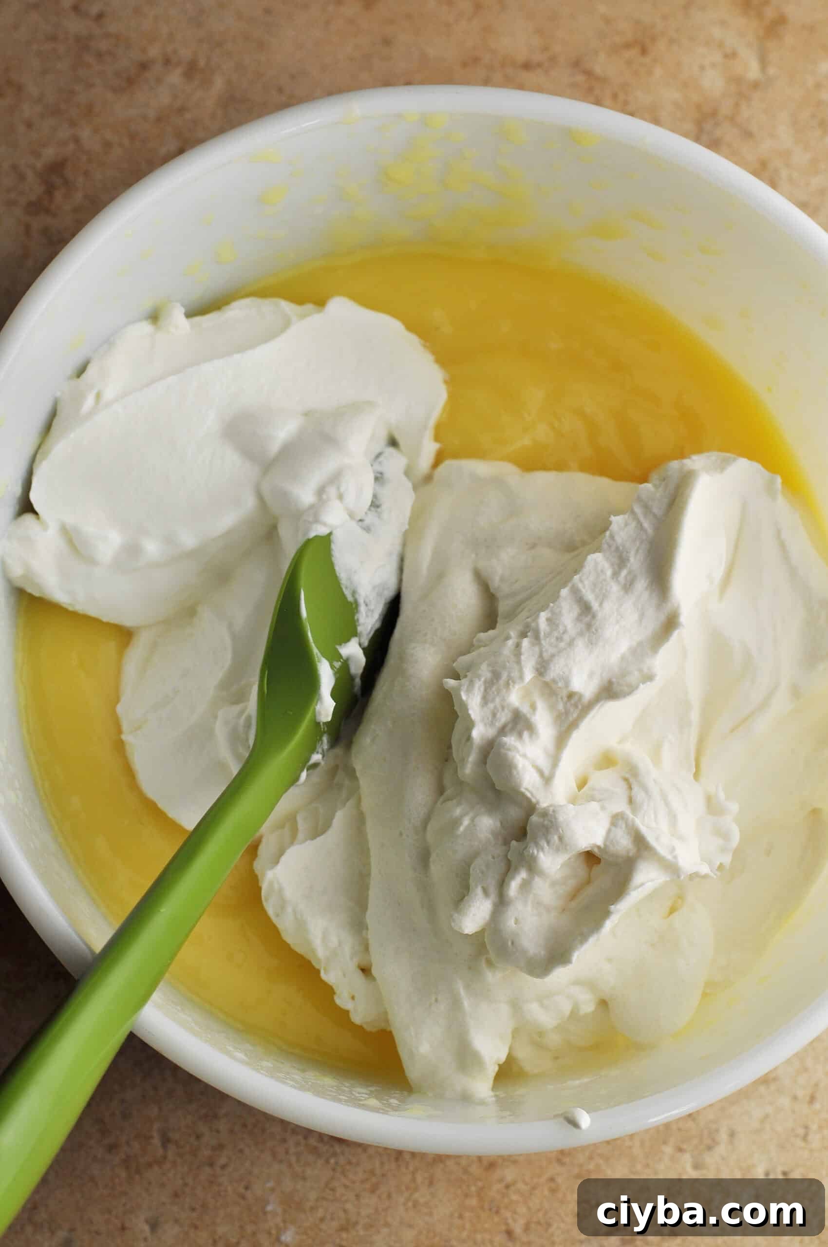 Adding sour cream to pudding mixture