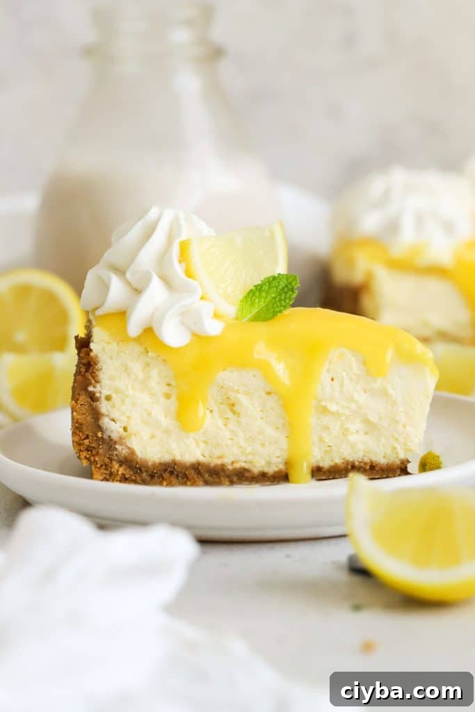 a slice of gluten-free lemon cheesecake with homemade lemon curd