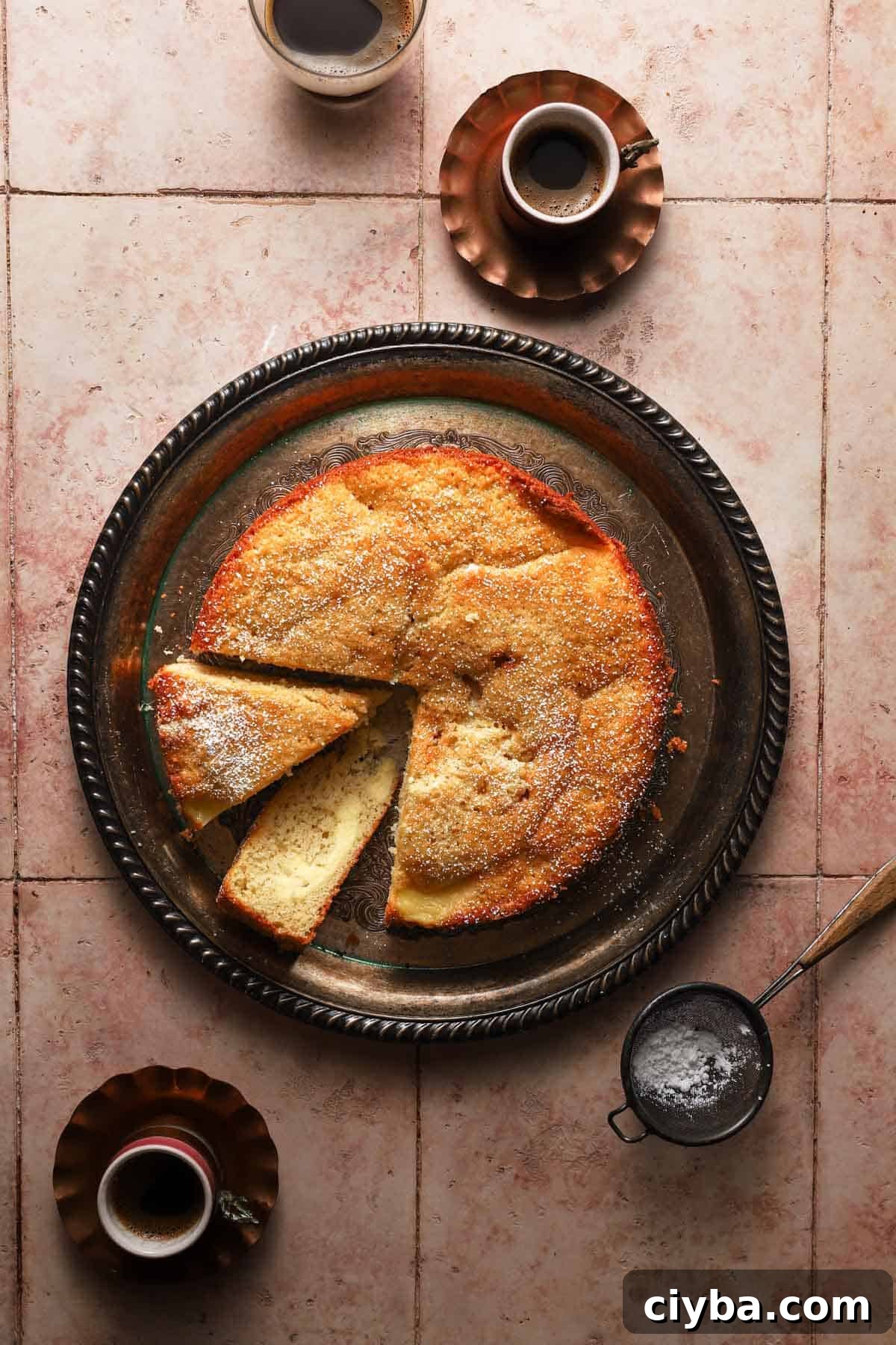 Torta Nua, sliced with cups of coffee around.