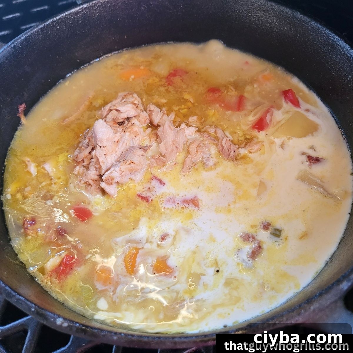 Smoked Salmon Chowder in dutch oven with heavy creamer added to it