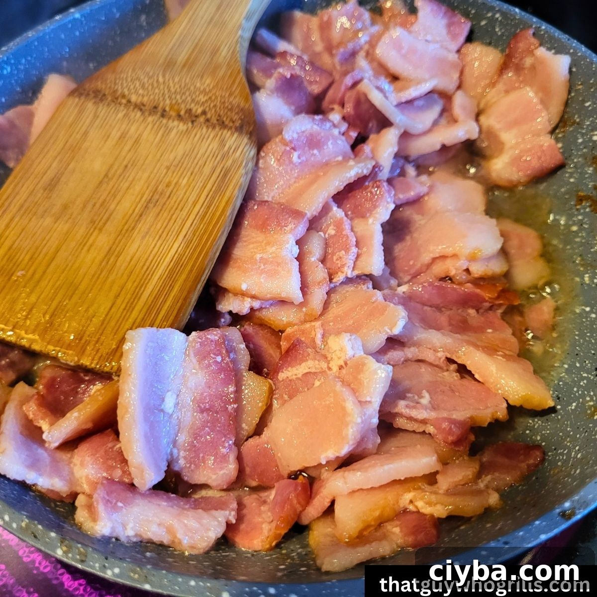 bacon sauting in a fry pan for salmon chowder