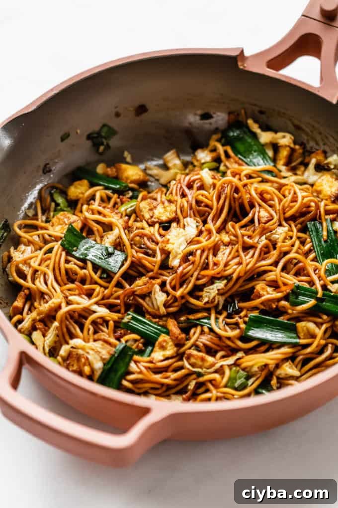 Stir-fried mie goreng noodles in a pan