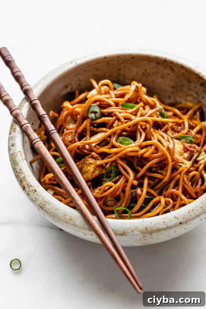 Mie goreng noodles in a white speckled bowl