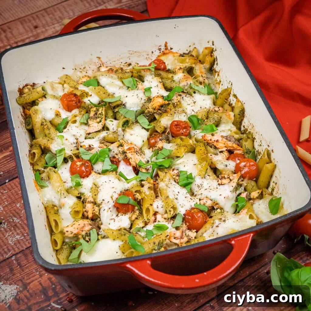 Salmon Pesto Pasta Bake with fresh chopped basil over the top