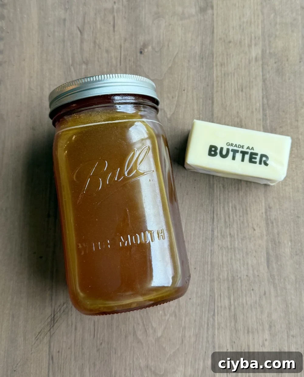 stick of butter and jar of raw honey.