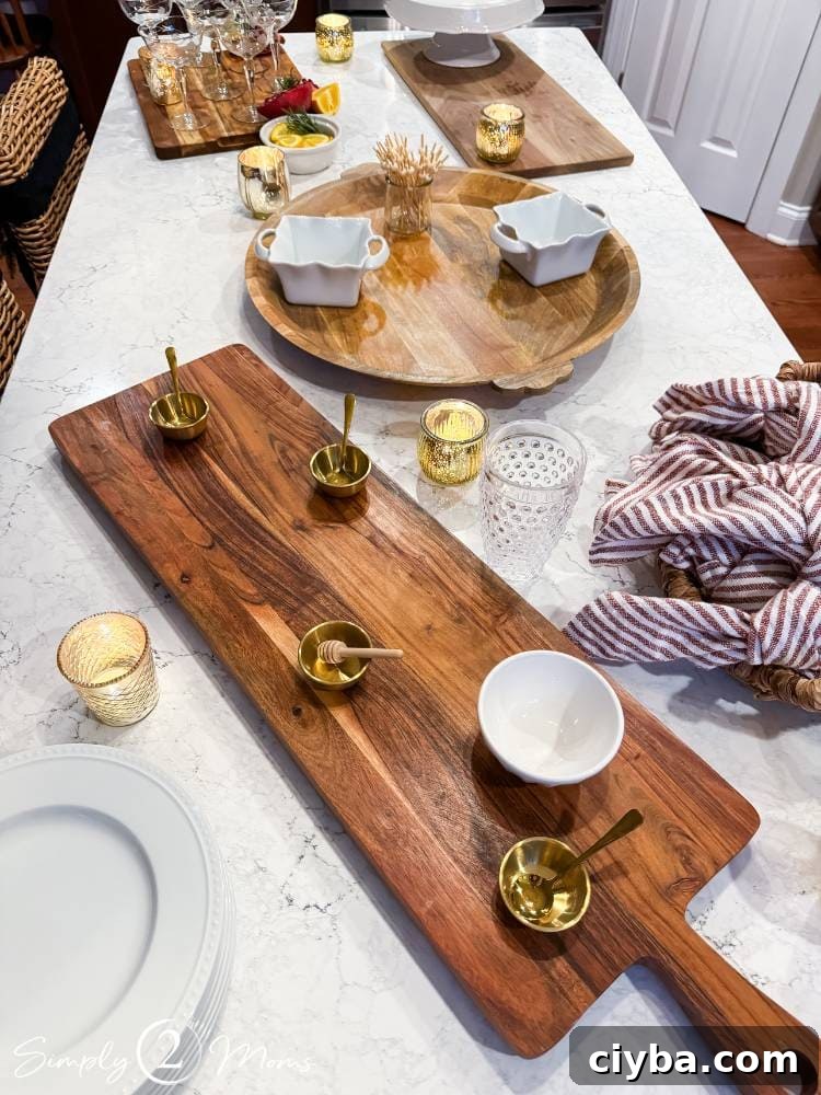 various wood charcuterie boards and small bowls laid out on kitchen island