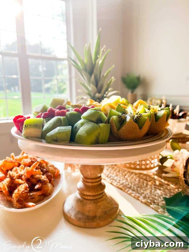 cut fruit on pedestal stand as part of party buffet table