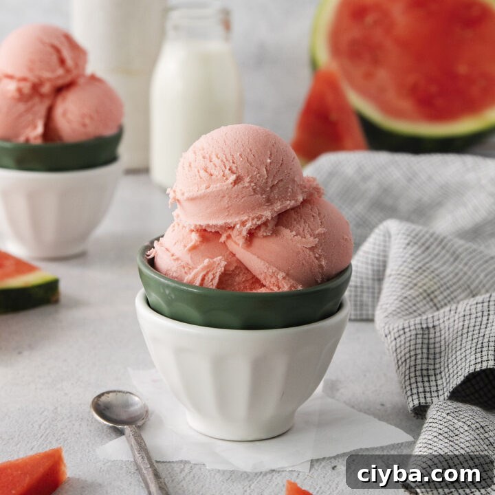 a bowl of homemade watermelon ice cream. Milk and fresh watermelon are in the background.