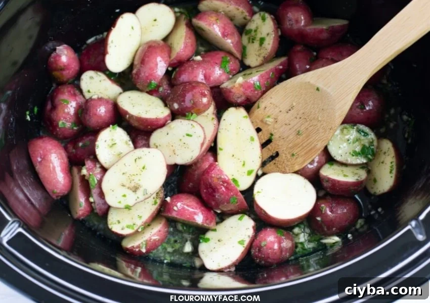 Slow Cooker Chicken and Potatoes with Garlic and Herbs 4 Baby red potatoes covered in olive oil and butter and tossed with fresh rosemary, parsley and minched garlic.