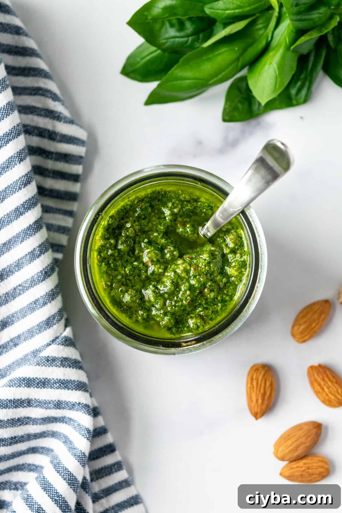 Almond Basil Pesto in a glass jar.