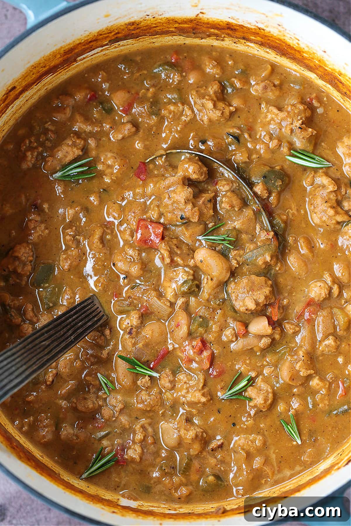turkey pumpkin chili in a pot with ladle