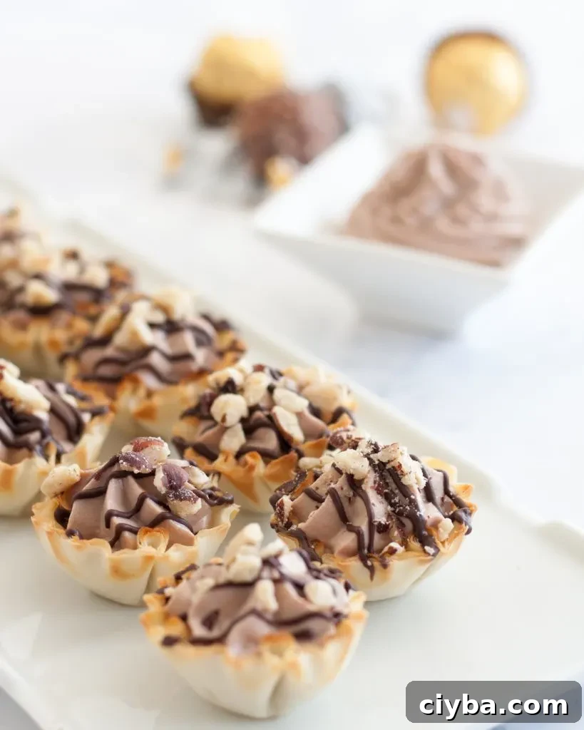 Finished Ferrero Rocher cannoli cups on a plate