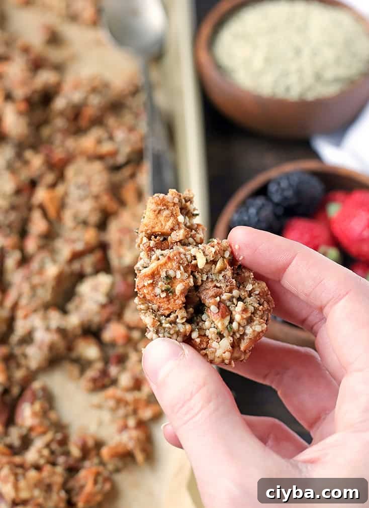 Granola spread on a tray ready to bake