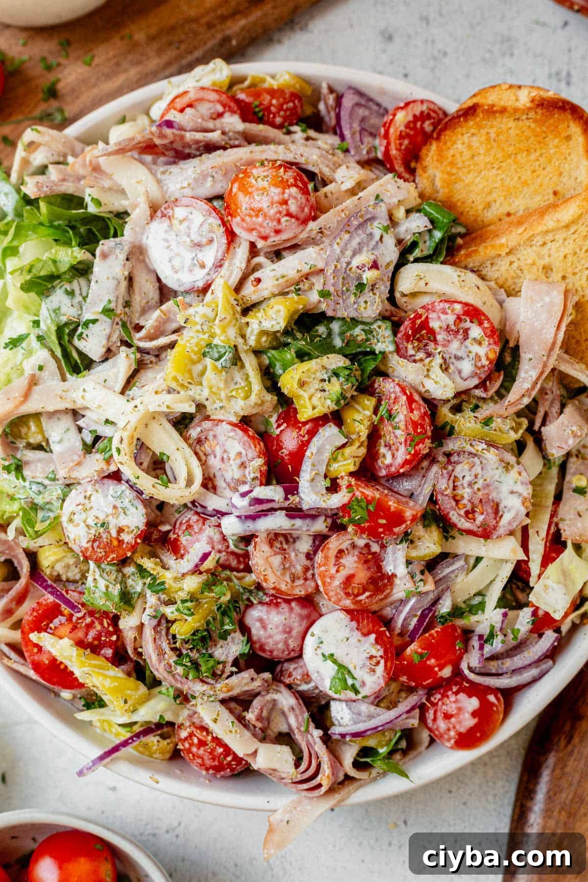 Italian Grinder Salad with Salami, Provolone & Vinaigrette 7 italian grinder salad in a salad bowl