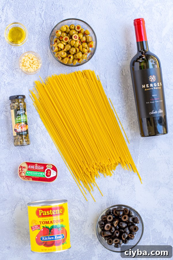 Authentic Spaghetti alla Puttanesca Recipe 4 Layout of all of the ingredients needed for Spaghetti Puttanesca including wine, spaghetti, tomatoes, olives, capers, anchovies, oil, and garlic
