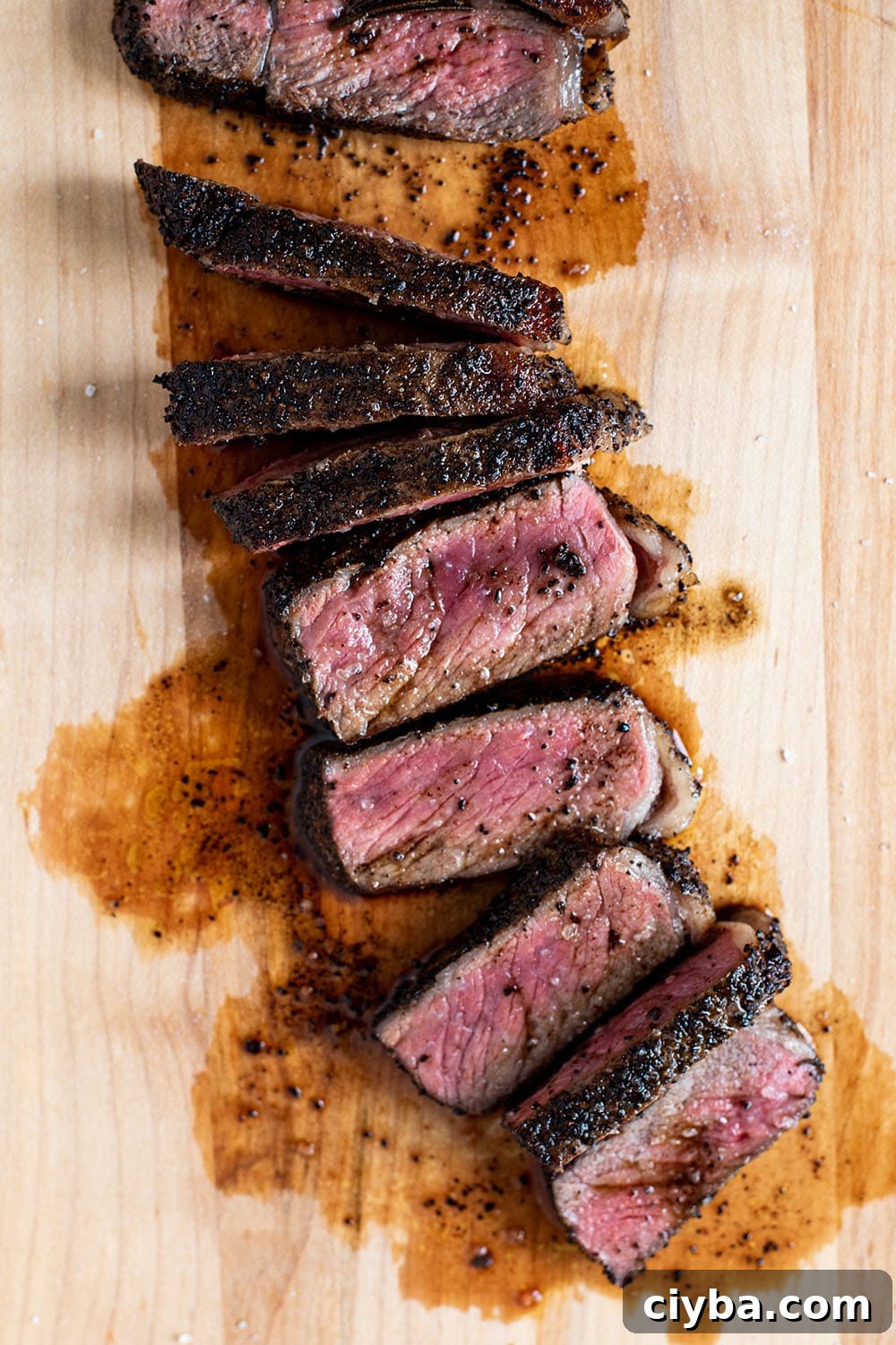 Coffee-Rubbed Steak Recipe for Tender, Flavorful Results 2 A perfect medium rare coffee rubbed NY strip steak that's charred on the exterior and sliced into strips.