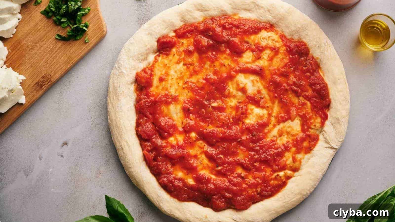 Despite a Busy Schedule, I Completed 17 Dips 3 Pizza sauce spread over a pizza crust.