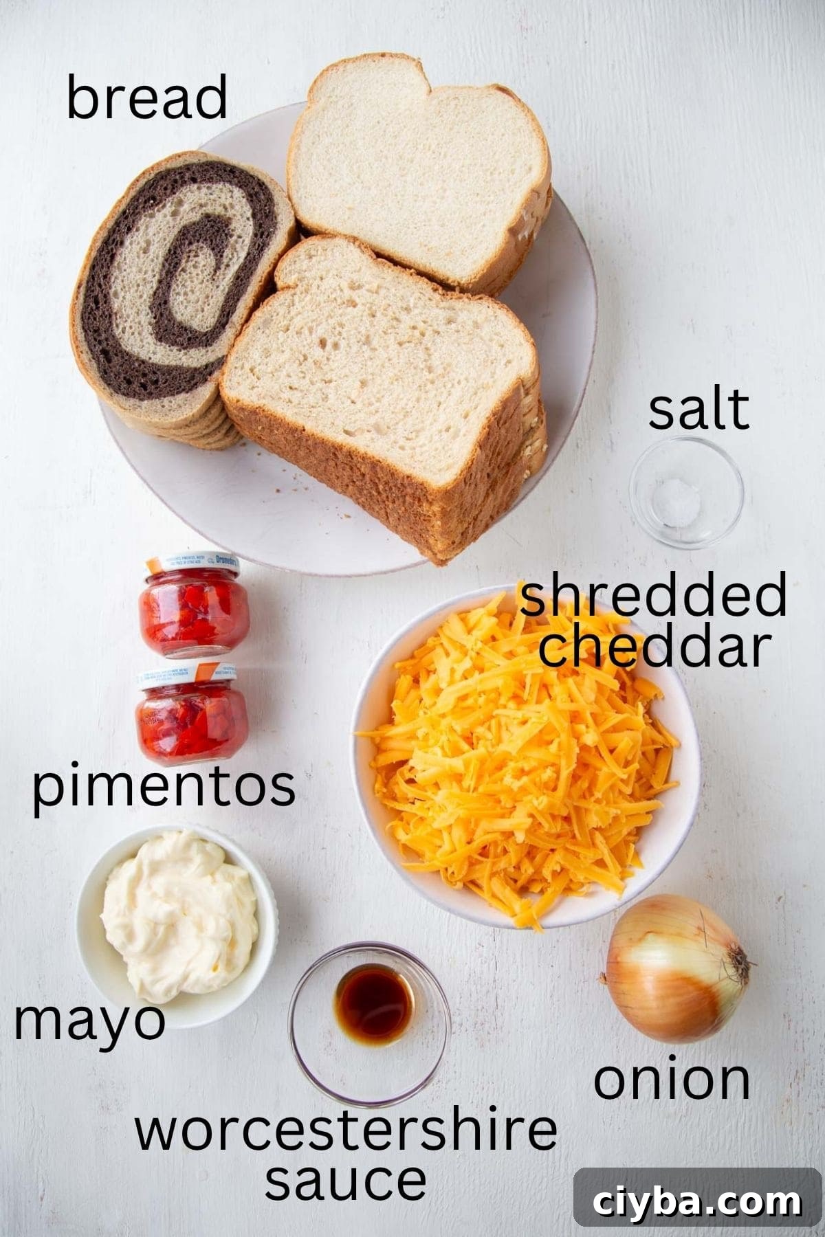 bread, shredded cheddar, pimentos, and other ingredients.